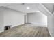 A spacious unfinished basement with gray walls and wood look laminate floors at 4220 Chapel Hill Farms Dr, Douglasville, GA 30135