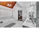 Bright primary bathroom featuring double sinks, a soaking tub and a view into the bedroom at 4220 Chapel Hill Farms Dr, Douglasville, GA 30135