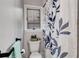 Cozy bathroom with floral shower curtain and window for natural light at 4220 Chapel Hill Farms Dr, Douglasville, GA 30135