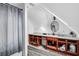 Angled ceiling bathroom featuring unfinished cabinets, a sink, and a shower curtain at 4220 Chapel Hill Farms Dr, Douglasville, GA 30135