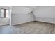 A neutral painted bedroom features a closet and wood-look floors at 4220 Chapel Hill Farms Dr, Douglasville, GA 30135