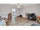 Large, open bedroom has wood floors and a view of the kitchen at 4220 Chapel Hill Farms Dr, Douglasville, GA 30135