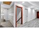Spacious hallway with unfinished walls and modern grey vinyl flooring at 4220 Chapel Hill Farms Dr, Douglasville, GA 30135
