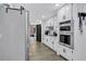 Well-equipped kitchen featuring modern appliances, white cabinetry, and a functional layout at 4220 Chapel Hill Farms Dr, Douglasville, GA 30135