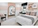 Charming bedroom with a light color palette, accented with a large mirror and trendy decor at 5230 Hyde Rd, Cumming, GA 30040