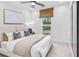Cozy bedroom featuring a neutral color palette, ceiling fan, and large window at 5230 Hyde Rd, Cumming, GA 30040