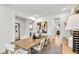 Bright dining room featuring a wood table with seating for six and stylish decor at 5230 Hyde Rd, Cumming, GA 30040