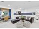 Inviting living space with comfortable seating, striped accent wall, and a cozy work area by the window at 5230 Hyde Rd, Cumming, GA 30040