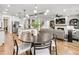 Open concept living space offering kitchen, living, and dining areas, all with abundant natural light at 5230 Hyde Rd, Cumming, GA 30040