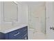Modern bathroom showcasing a blue vanity with white countertops and a glass-enclosed walk-in shower at 4356 N Buckhead Ne Dr, Atlanta, GA 30342