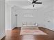 Relaxing bonus room features hardwood floors, natural light, and a comfortable white sofa at 4356 N Buckhead Ne Dr, Atlanta, GA 30342
