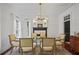 Inviting dining room featuring hardwood floors, a modern chandelier, and ample natural light at 4356 N Buckhead Ne Dr, Atlanta, GA 30342