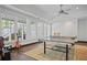 Game room showcases a ping pong table with hardwood floors, white walls, and bright natural light at 4356 N Buckhead Ne Dr, Atlanta, GA 30342