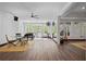 Spacious game room with wood flooring, an entertainment area, and natural light from the surrounding windows at 4356 N Buckhead Ne Dr, Atlanta, GA 30342