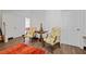 Entryway features hardwood floors, white walls, and two chairs next to a center table with doors nearby at 4356 N Buckhead Ne Dr, Atlanta, GA 30342
