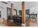 Spacious kitchen with dark cabinetry, wooden pillars, large center island, and stainless steel appliances at 4356 N Buckhead Ne Dr, Atlanta, GA 30342