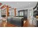 Open-concept kitchen with a large center island, breakfast bar, custom cabinets, and wood beam ceiling at 4356 N Buckhead Ne Dr, Atlanta, GA 30342