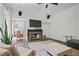 Stylish living room featuring a fireplace, built-in speakers, and a view into the dining area at 4356 N Buckhead Ne Dr, Atlanta, GA 30342