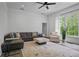 Cozy living room with plush seating, neutral decor, and a large window providing ample natural light at 4356 N Buckhead Ne Dr, Atlanta, GA 30342