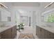 Beautiful main bathroom with and sinks, a soaking tub, and a glass shower at 4356 N Buckhead Ne Dr, Atlanta, GA 30342