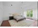 Bright main bedroom with a large bed, a decorative rug, and white curtains and trim at 4356 N Buckhead Ne Dr, Atlanta, GA 30342