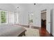 View of main bedroom with an attached wet bar and windows bringing in natural light at 4356 N Buckhead Ne Dr, Atlanta, GA 30342
