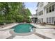 Backyard pool surrounded by stone and lush landscaping at 4356 N Buckhead Ne Dr, Atlanta, GA 30342