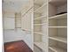 Spacious walk-in closet featuring ample shelving and hanging space for organized storage at 4356 N Buckhead Ne Dr, Atlanta, GA 30342