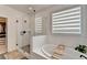 Modern bathroom featuring a glass shower and a soaking tub with a caddy at 4391 Encore Blvd, Duluth, GA 30097