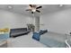 This bedroom features neutral walls, carpet, and a ceiling fan, offering a comfortable and adaptable space at 4391 Encore Blvd, Duluth, GA 30097