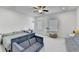 Spacious bedroom featuring neutral tones, ceiling fan, and a sofa at 4391 Encore Blvd, Duluth, GA 30097