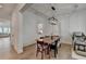 Light-filled dining area features wood floors, stylish light fixture, and comfortable seating, perfect for gatherings at 4391 Encore Blvd, Duluth, GA 30097