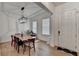 Bright dining room showcases hardwood floors, modern lighting, and an inviting space for meals and relaxation at 4391 Encore Blvd, Duluth, GA 30097