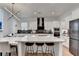 Modern kitchen featuring a large island with seating, state-of-the-art appliances, and sleek cabinetry for a stylish look at 4391 Encore Blvd, Duluth, GA 30097