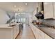 Open-concept kitchen boasts a large island, stainless steel appliances, and modern cabinetry, ideal for cooking and entertaining at 4391 Encore Blvd, Duluth, GA 30097