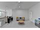 Spacious loft area featuring a piano, seating area, and plenty of natural light, perfect for relaxation or entertainment at 4391 Encore Blvd, Duluth, GA 30097