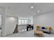 Cozy loft with natural light, a piano, comfortable seating, and an open view of the lower level at 4391 Encore Blvd, Duluth, GA 30097