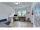 Well-lit home office with a desk, ample storage, and a comfortable seating area at 4391 Encore Blvd, Duluth, GA 30097
