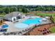 This aerial displays a community pool with ample seating and a clubhouse, promising relaxation at 4391 Encore Blvd, Duluth, GA 30097