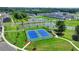 This aerial showcases tennis courts nestled within the community's lush landscaping and ponds at 4391 Encore Blvd, Duluth, GA 30097