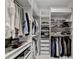 Organized walk-in closet with shelving, drawers, and hanging space for clothing and accessories at 4391 Encore Blvd, Duluth, GA 30097