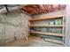 Unfinished basement with shelving, concrete walls, and a concrete floor ready for storage at 1145 Cool Springs Nw Dr, Kennesaw, GA 30144