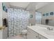 Full bathroom featuring a vanity, toilet, shower with sea life curtain, and matching decor at 1145 Cool Springs Nw Dr, Kennesaw, GA 30144
