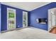 Bedroom features large windows, blue walls and plush carpeting at 1145 Cool Springs Nw Dr, Kennesaw, GA 30144