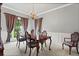 Elegant dining room with crown molding, chair rail, and a chandelier at 1145 Cool Springs Nw Dr, Kennesaw, GA 30144