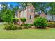 Landscaped front yard showcasing the brick exterior of this beautiful two-story home at 1145 Cool Springs Nw Dr, Kennesaw, GA 30144
