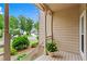 Inviting front porch featuring decorative columns and views of the neighborhood at 1145 Cool Springs Nw Dr, Kennesaw, GA 30144