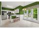 Spacious kitchen with white cabinets, stainless steel appliances, and eat-in breakfast bar area at 1145 Cool Springs Nw Dr, Kennesaw, GA 30144