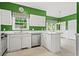 Well-equipped kitchen with white cabinets, stainless steel appliances, and lots of natural light at 1145 Cool Springs Nw Dr, Kennesaw, GA 30144