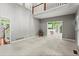 Bright and airy living room with tall ceilings and views into the kitchen at 1145 Cool Springs Nw Dr, Kennesaw, GA 30144